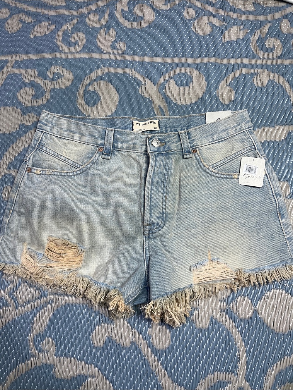 We The Free faded light blue distressed denim cutoff shorts